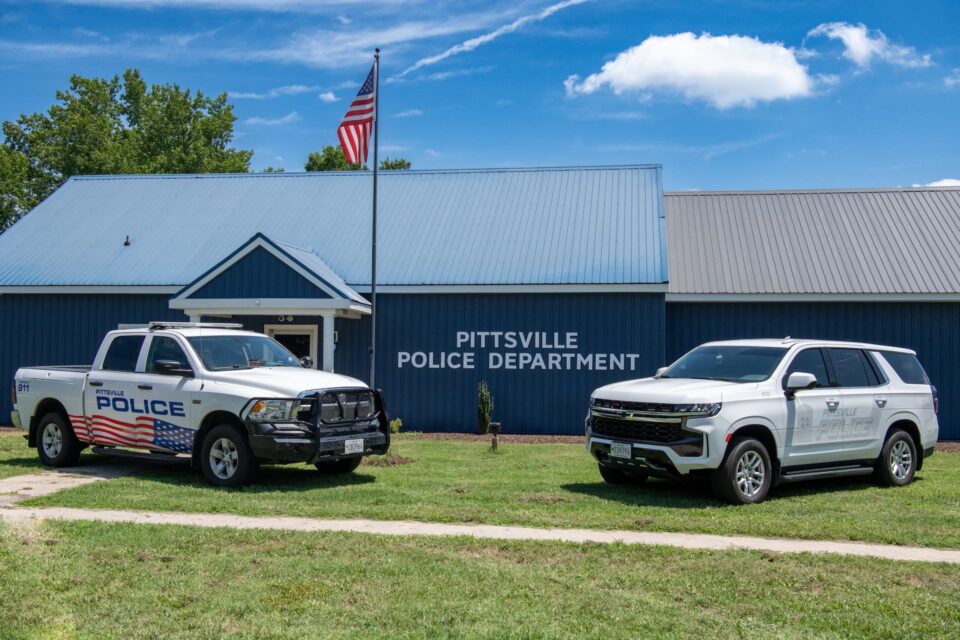 Agency vehicles positioned in front of Pittsville Police Department.
